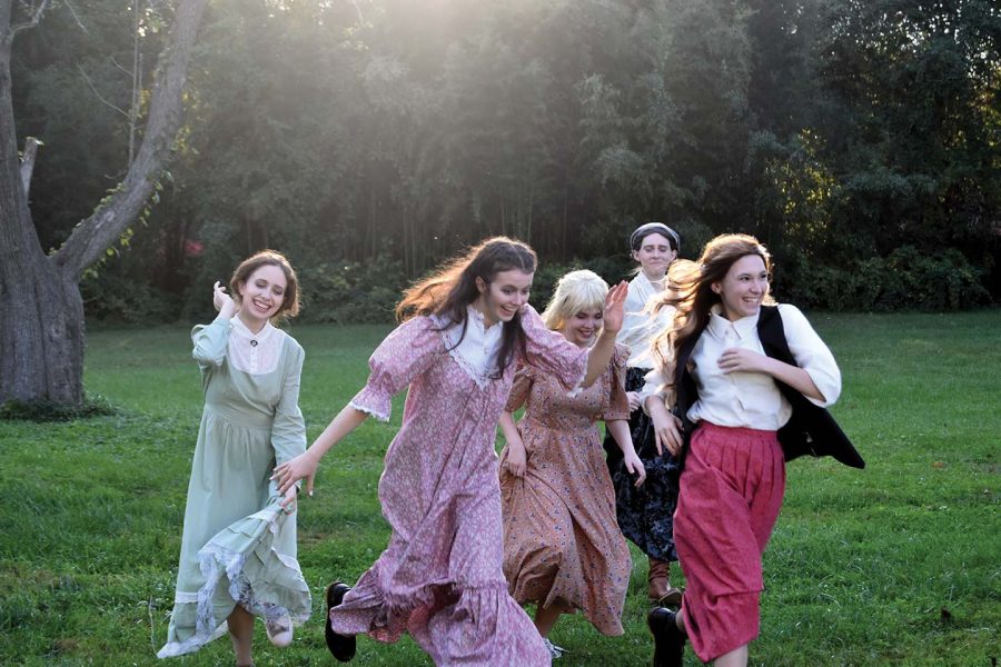 Kirsten Knight as Meg, Kiera Murphy as Beth, Franny Hemsley as Amy, Kirsten Tierney as Marmee and Kylee Majkowski as Jo run through Lewinsville Park during their Little Women publicity photoshoot on Oct. 14.