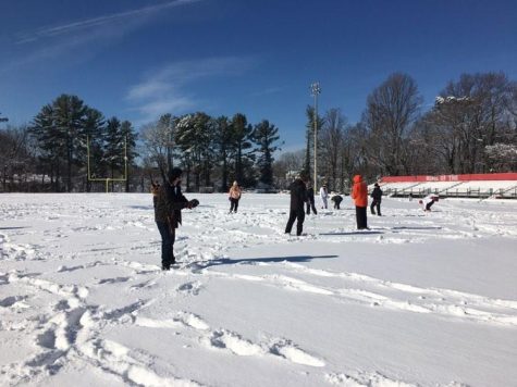 Students participate in a snowball fight on the football field Tuesday, Jan. 4. Schools were closed due to inclement weather for the entire week.
