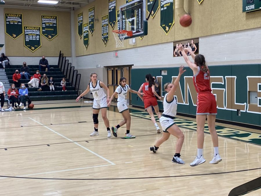 Freshman Vilte Kacerauskaite takes a corner jumpshot in the third quarter. Kacerauskaites prowess on both sides of the ball helped propel McLean to victory.