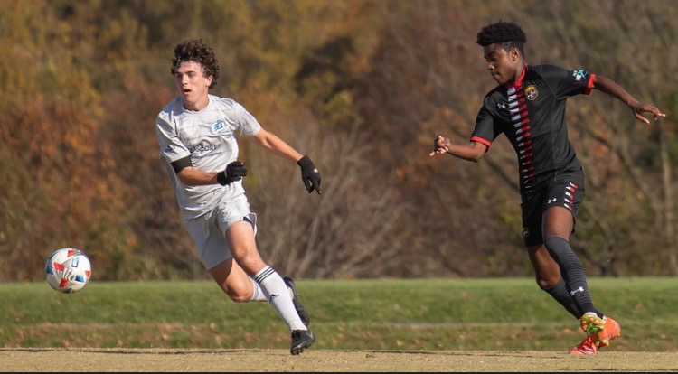 Junior Matthew Helfrich plays at a game for the Bethesda Soccer Club.