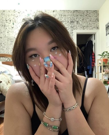 Senior Chloe Zhu promotes her makeup looks on social media. [I took these photos] because I realized that the Band-Aid matched my makeup look, Zhu said.