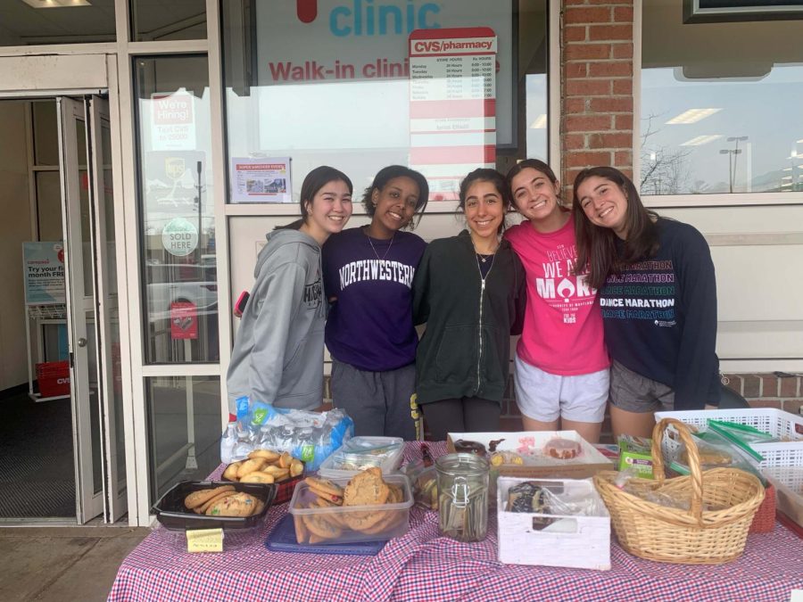 McDance-a-Thon executives Bella DeMarco, Maya Amman, Amelia Badipour, Sydney Gleason and Gianna Russo raise money for Childrens National Hospital at a bake sale in front of CVS. The club does several fundraisers throughout the year to work toward their goal before the dance on March 26.