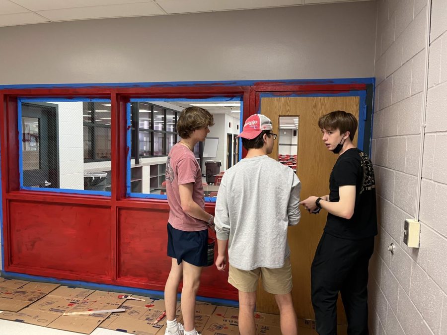 Seniors JT Fulkerson, Jackson Canter and Will Scherer discuss the construction of the senior lounge, a gift from the class of 2022. 