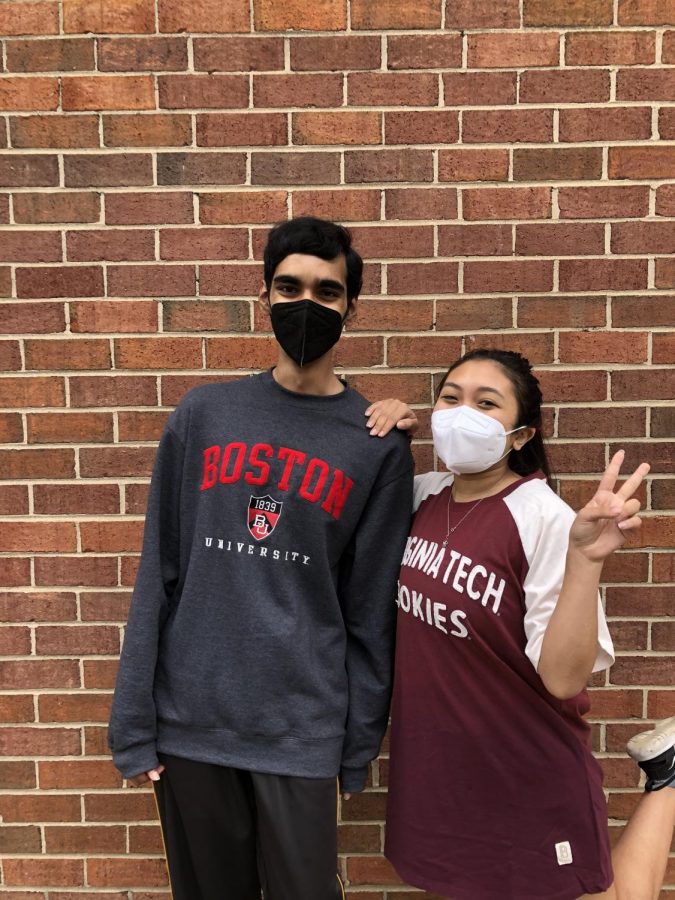 COMMITMENT+DAY+-+Seniors+Naveen+Patury+and+Tisha+Maskey+pose+in+their+college+shirts.+Both+have+committed+to+colleges+and+are+excited+for+the+next+four+years+of+their+lives.+