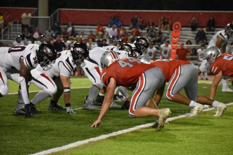 The Highlander defense approaches the line of scrimmage. McLeans defense was a large part of why the game remained close.