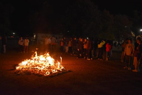Students gather around a bonfire started by MHS administration to celebrate and socialize.