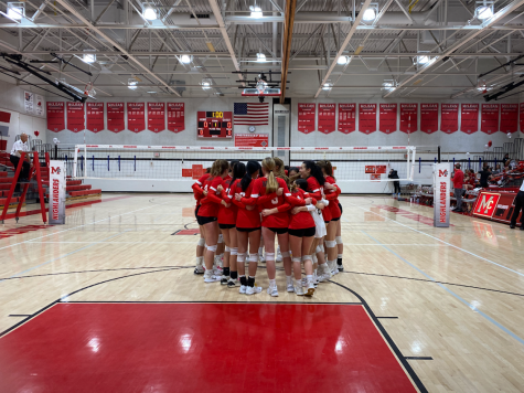 The team comes together before the match to share words of encouragement and set the tone for the night.