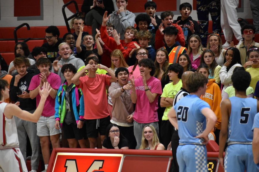 The McLean student section taunts Yorktowns bench after a crucial Yorktown starter fouls out.
