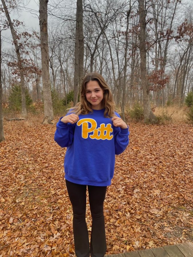 Brooks poses with her Pitt sweatshirt to announce her verbal commitment to continue her diving career.