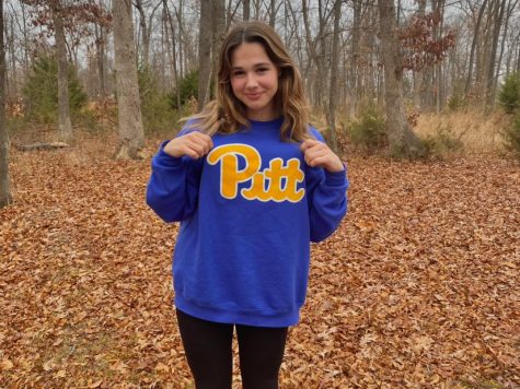 Brooks poses with her Pitt sweatshirt to announce her verbal commitment to continue her diving career.