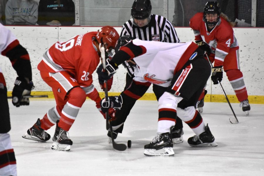 Junior Soup DuCharme faces off against a Madison player in a battle for the puck.