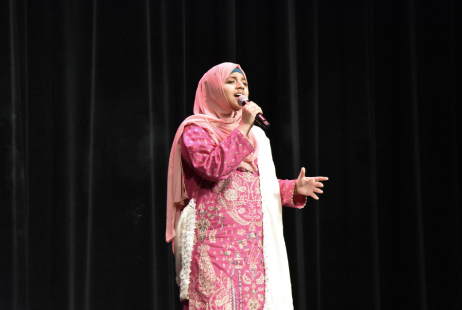 Senior Sarah Malik sings a traditional song during the stage performances.