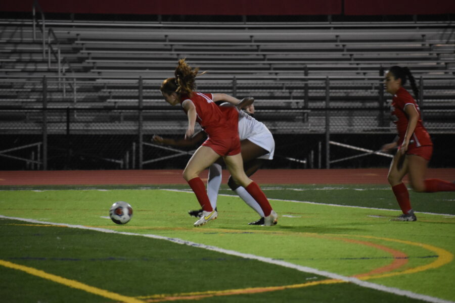 With support from her teammate, Andreoli dribbles past a West Potomac defender.
