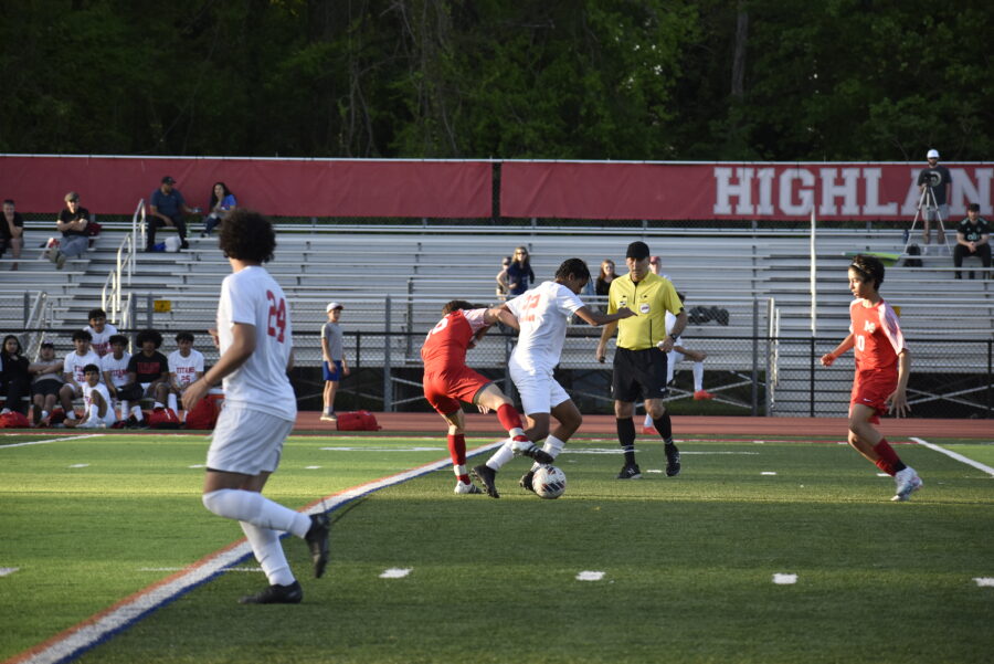 McLean holds their ground, battling for control of the ball.