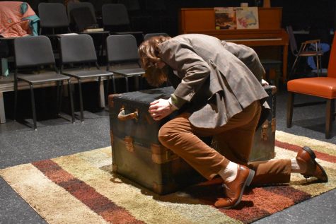 Charles Granillo, played by Noah Chlan, desperately pushes the chest containing the body of his murder victim.