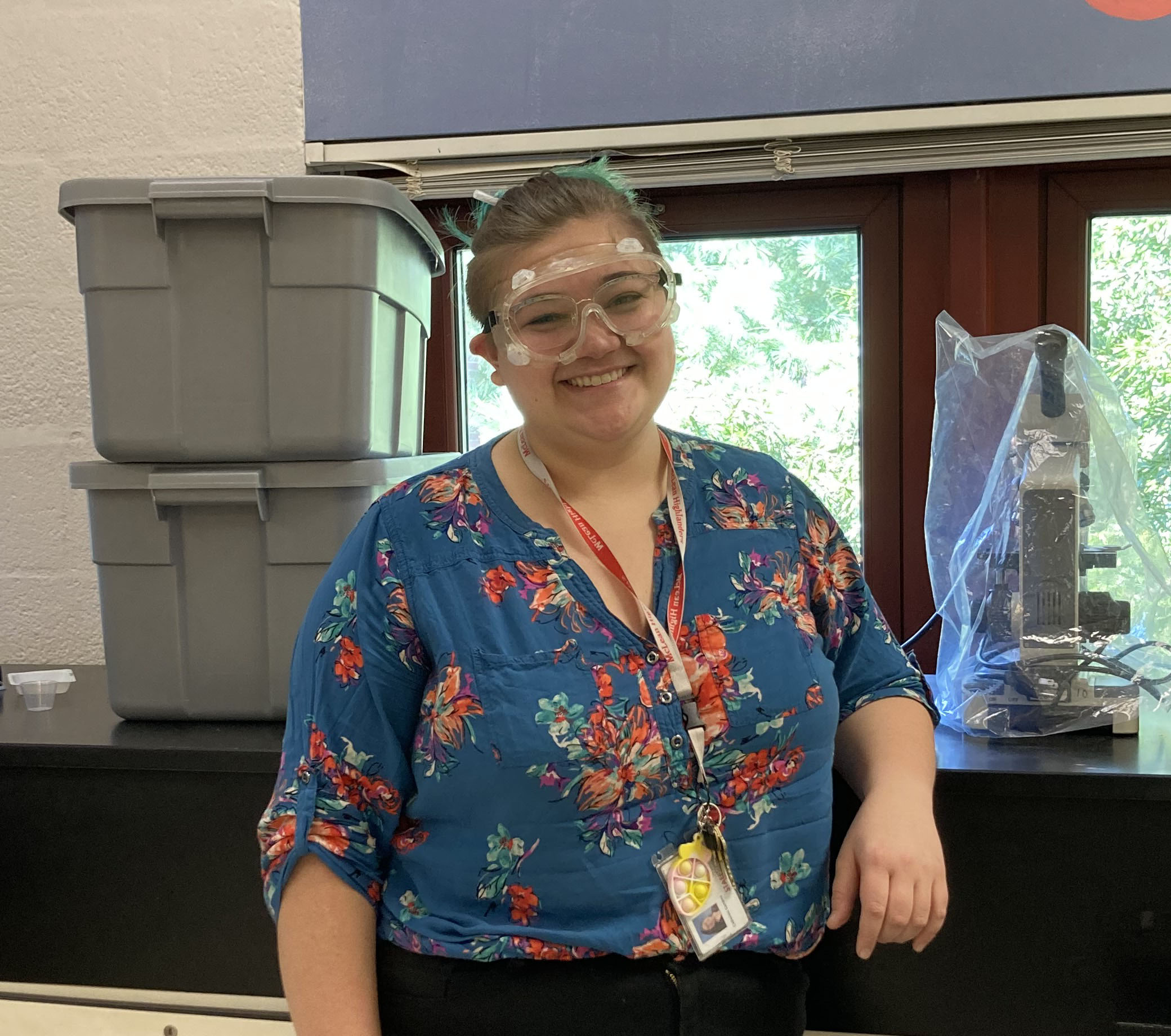 New chemistry teacher Cat Gamboa poses in her lab, excited to meet new students.