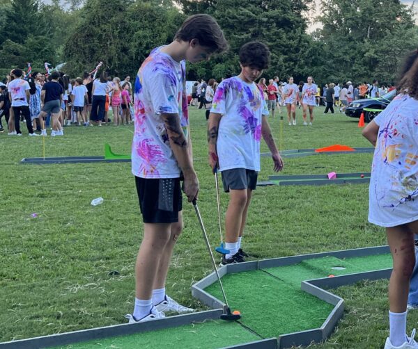 Students participate in the mini-golf course offered by the golf team at McLean.