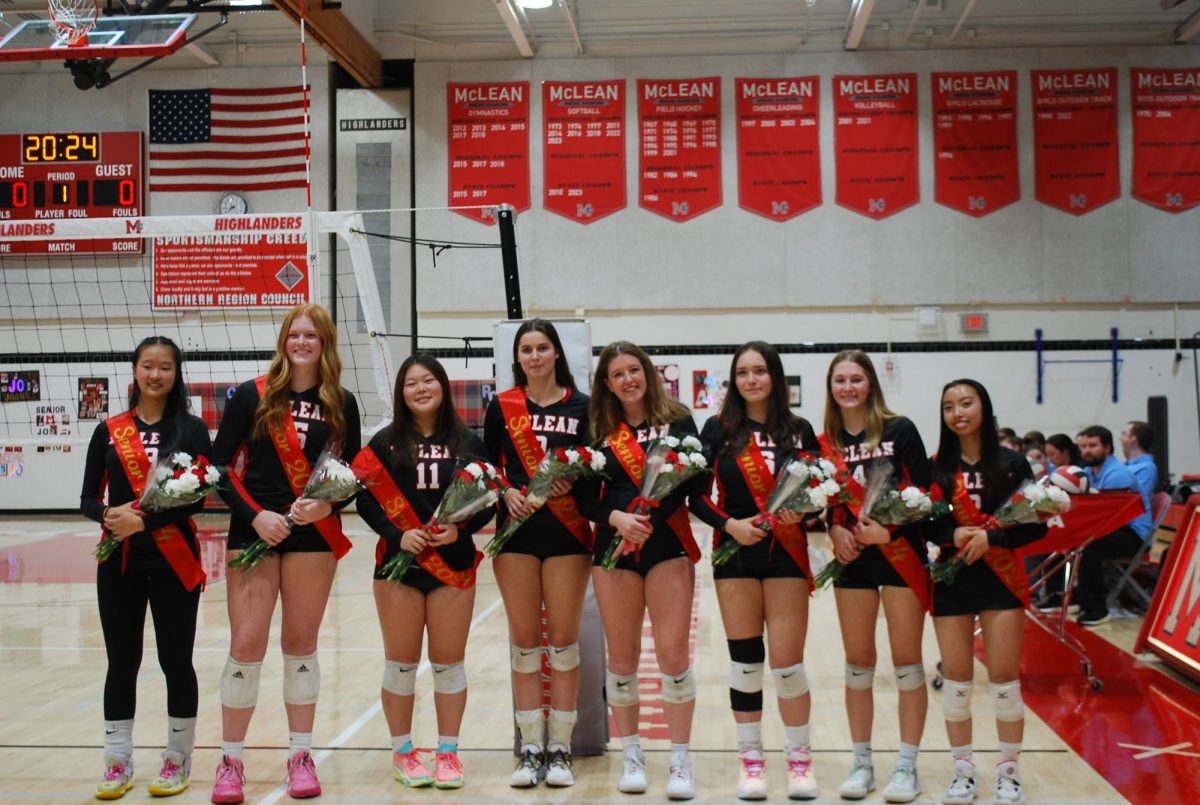 McLean volleyball seniors gather together during the graduation ceremony to honor all their hard work and dedication to the team.