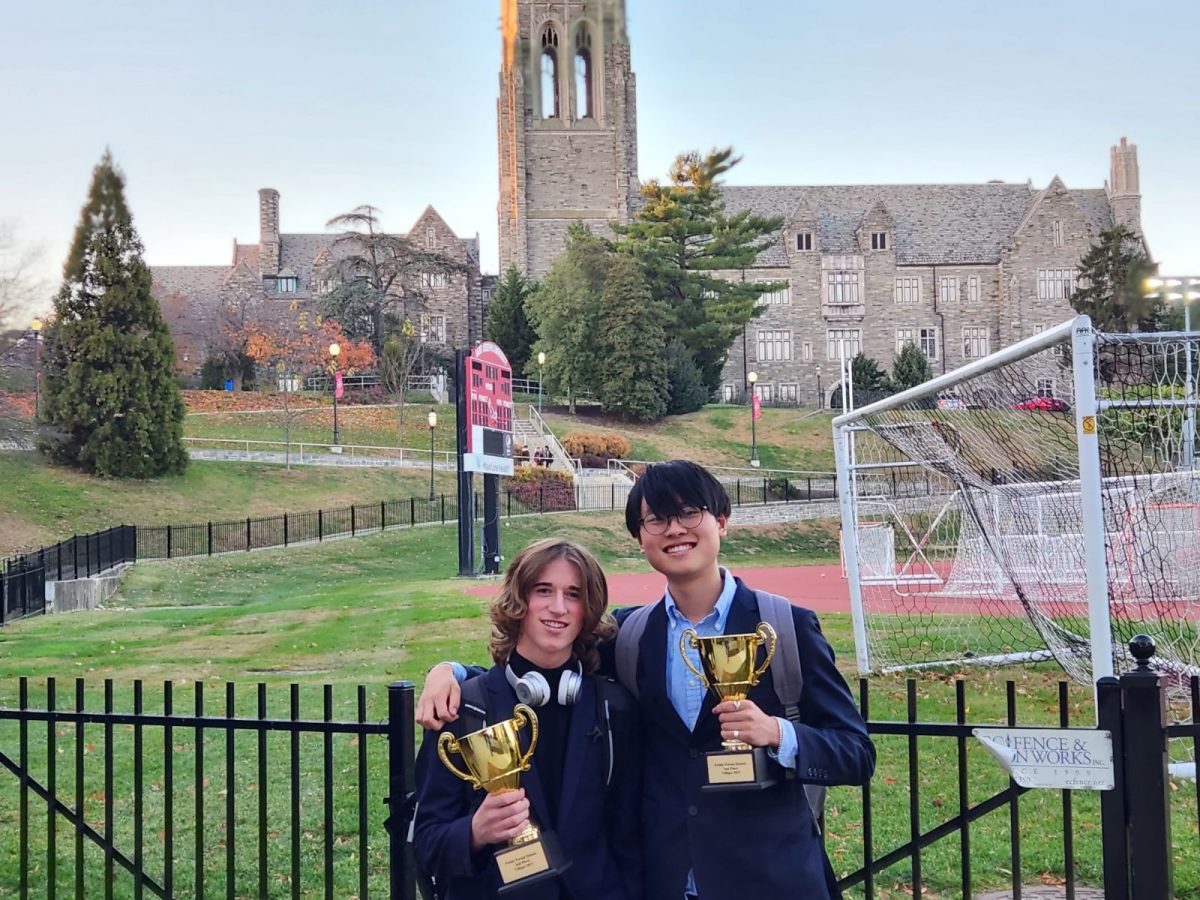 Sophomores+Tobin+Wilson+%28left%29+and+Ryan+Kang+%28right%29+holding+their+trophies+after+their+success+at+the+Villiger+Tournament.+The+Villiger+Tournament+is+a+national+debate+competition+held+annually+in+Philadelphia.