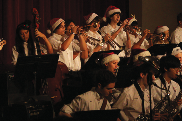Jazz ensemble first performs for McLean at the winter concert during school. The band performed Hay Burner, All I Want For Christmas Is You, White Christmas and Here Comes Santa Claus.