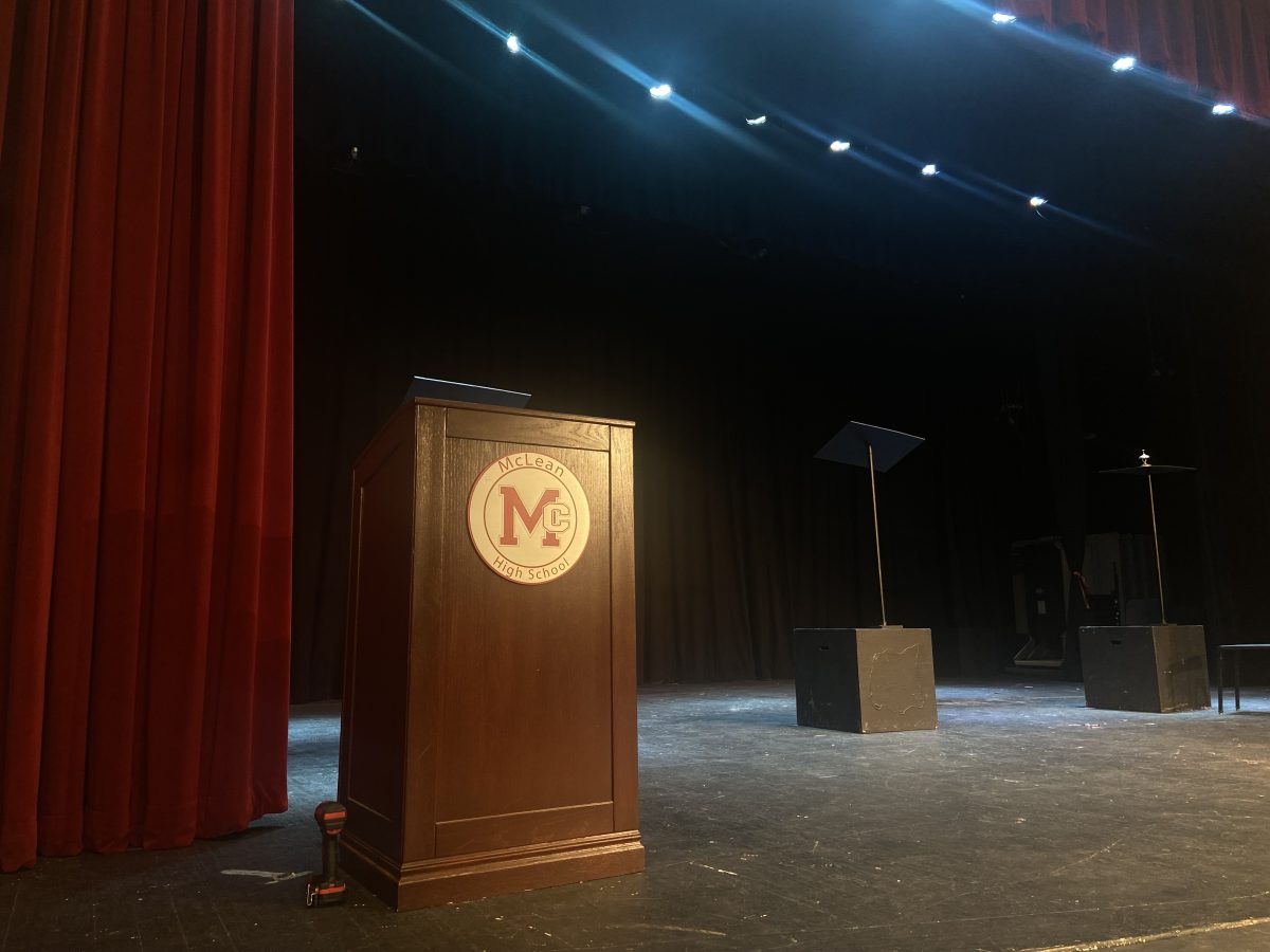 The illuminated McLean auditorium is ready for the third PTSA meeting of the 2023-2024 academic year, in which speaker Kathleen Otal will discuss student mental wellness at the podium.