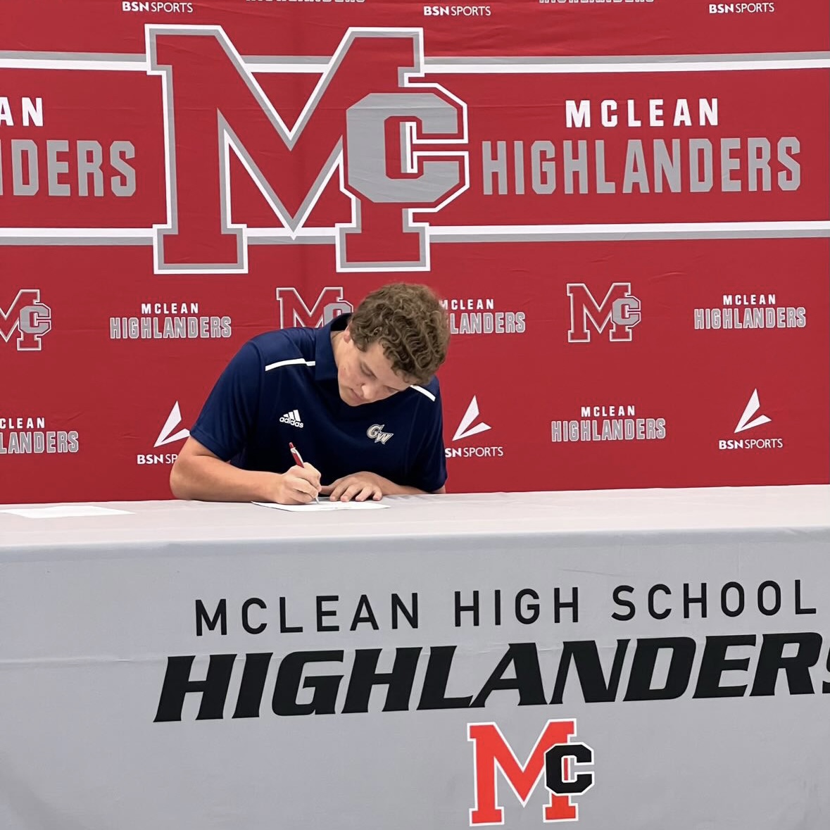 Carey+signs+his+official+National+Letter+of+Intent+to+play+baseball+at+GW+University+this+fall+at+McLeans+fall+signing+day+on+Nov.+11.