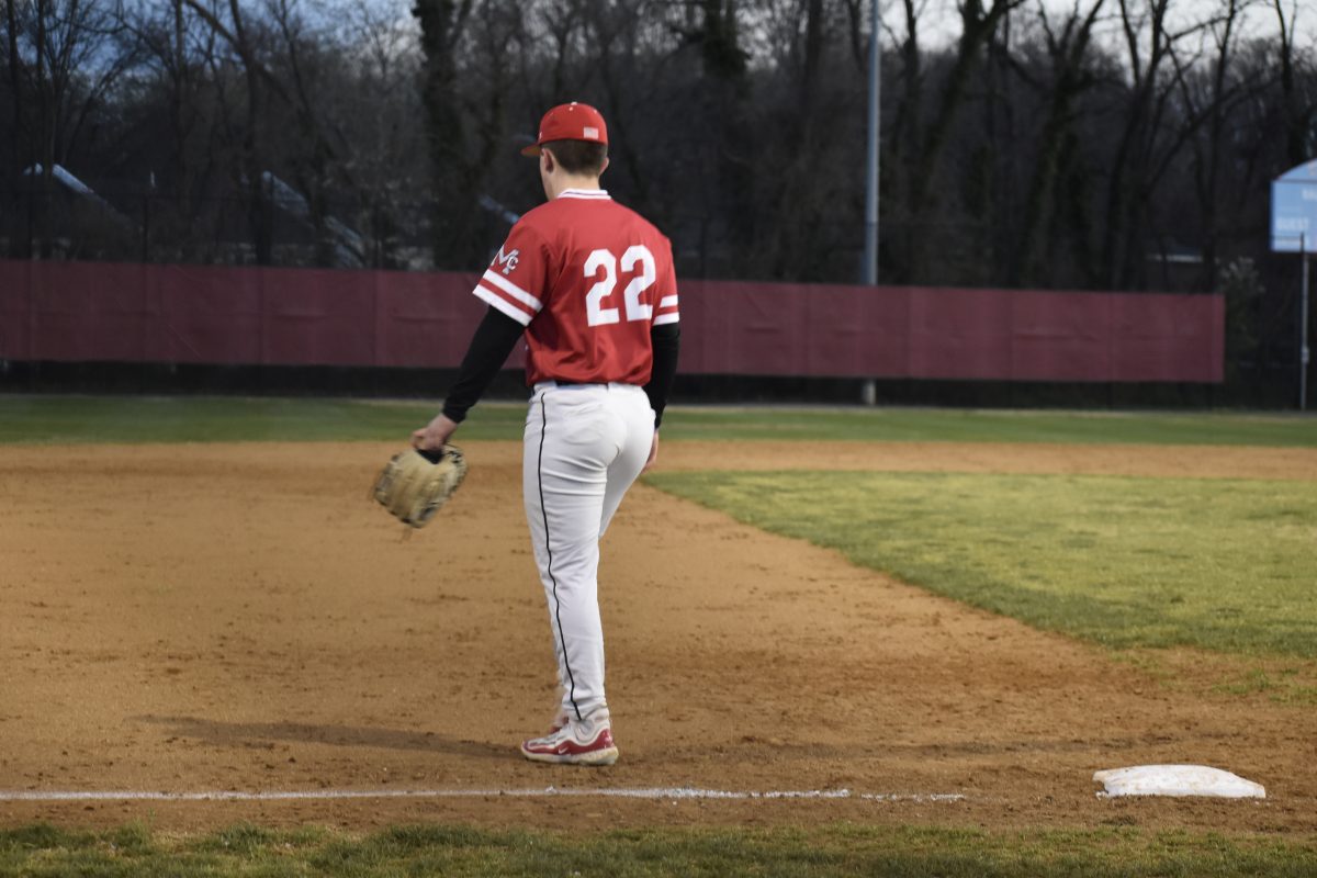Junior third baseman Aydin Prell takes the field. Like Prell, most players were wearing undershirts to stay warm in Monday nights below-freezing windchill.