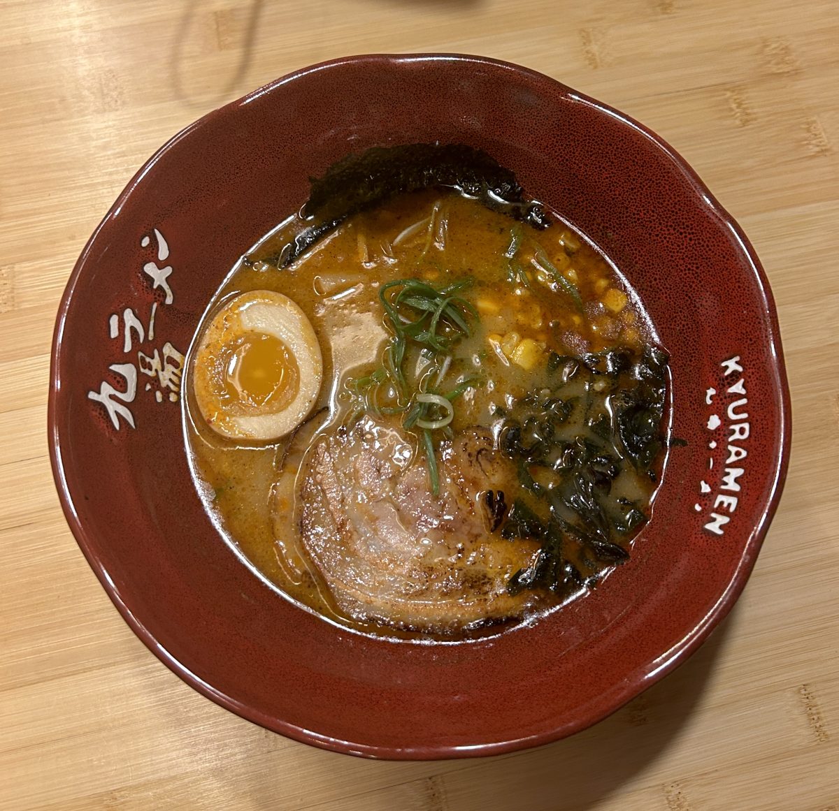 The+Spicy+Kyushu+Tonkotsu+Ramen+is+a+flavorful+blend+of+soft+pork%2C+salty+seaweed%2C+bamboo+shoots%2C+nori%2C+corn%2C+scallions%2C+and+half+a+boiled+egg%2C+tied+together+with+slightly+al+dente+ramen+noodles.