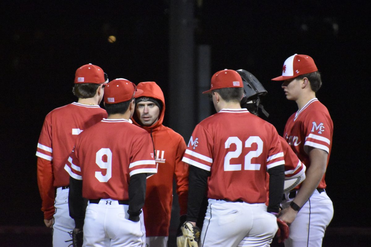 Assistant coach Joseph Coogan talks with pitcher Jack Nance and the rest of the infield in a mound visit earlier in the season. The Highlanders will need this level of organization and coordination to beat Glen Allen on Friday.
