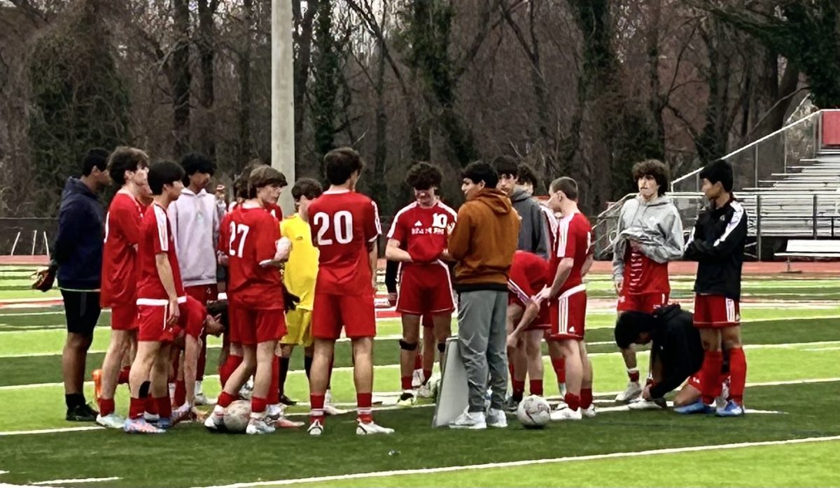 McLean JV boys soccer team huddle to discuss strategy minutes before their game. The Highlanders would wrap up the night with a 5-0 and 13-0 victory, JV and varsity respectively, over Mount Vernon.