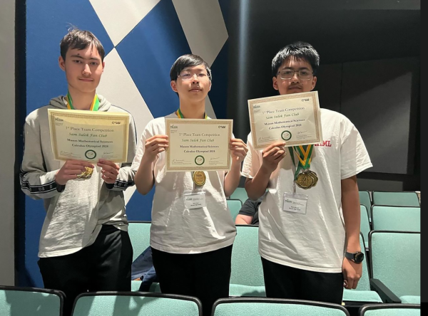Juniors Aiden Feyerherm and Ryan Chun along with freshman Kalan Warusa hold their first place awards at the GMU Calculus Olympiad.