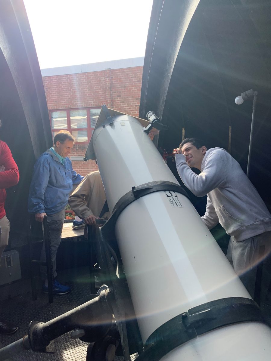 McLean's Astronomy Club makes adjustments to the school's telescope. The telescope is located in the observatory in the cafeteria courtyard, where the club will be hosting a sky watch tonight from 5 p.m. to 6:15 p.m. 