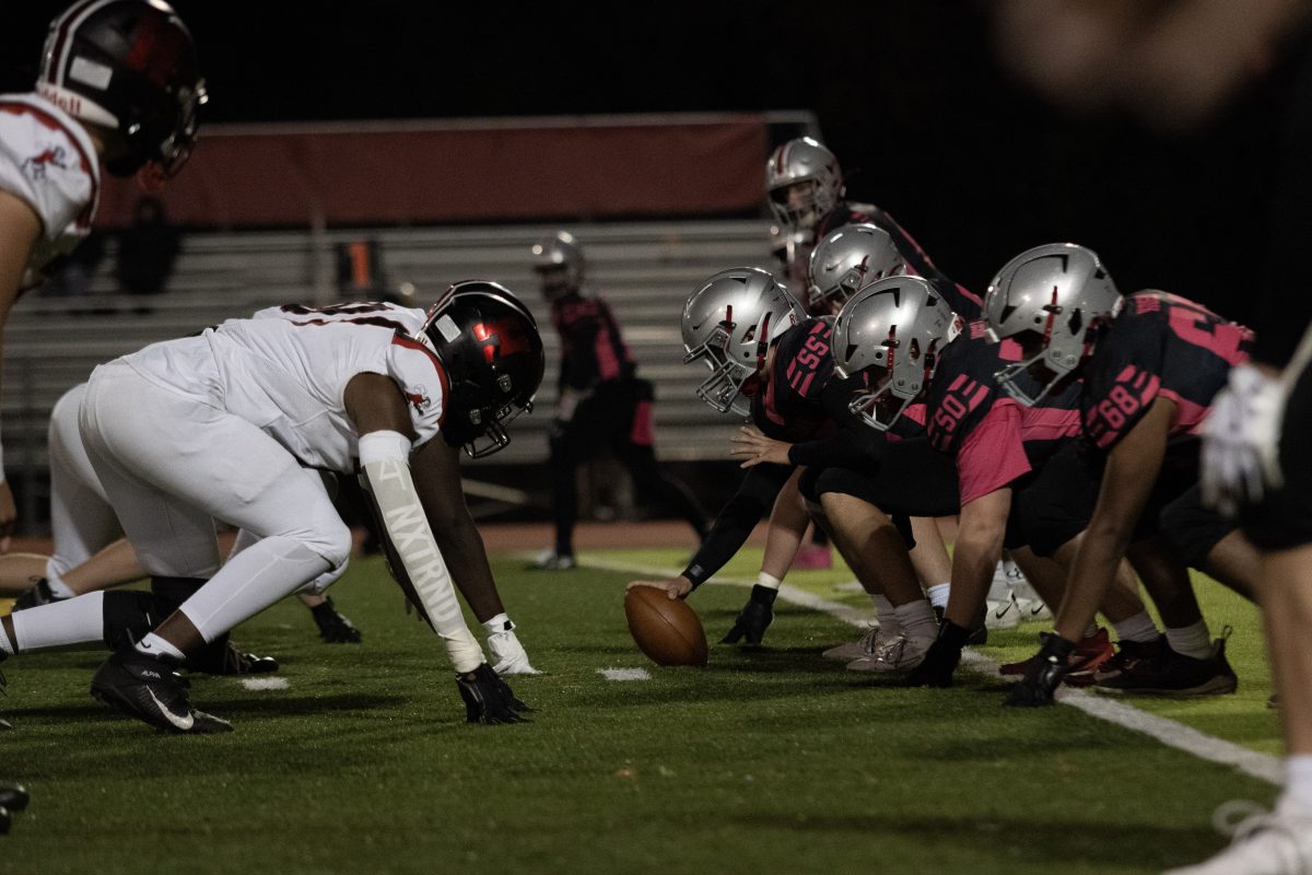 Highlander offensive linemen line up against the Hornet defensive line. The McLean line struggled with stopping the Hornets's rush.