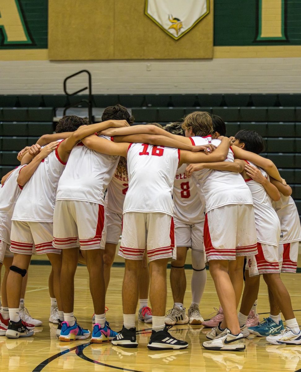 Boys Volleyball huddles and motivates one another before the match. Team chemistry and togetherness is one of the many reasons they have been so successful.