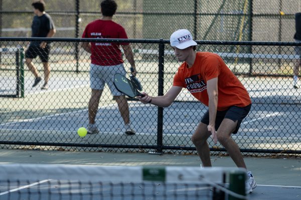 Junior Sam Rakowski puts the pickleball into play in his 21-13 win over Bishop O'Connell. 