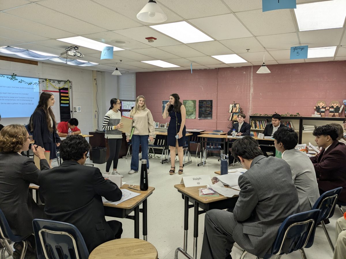 Students from schools around the DMV attentively listen to the crisis update from junior Mia Mortman, Co-Director of Crisis. The committee is tasked with creating a solution to the crisis.