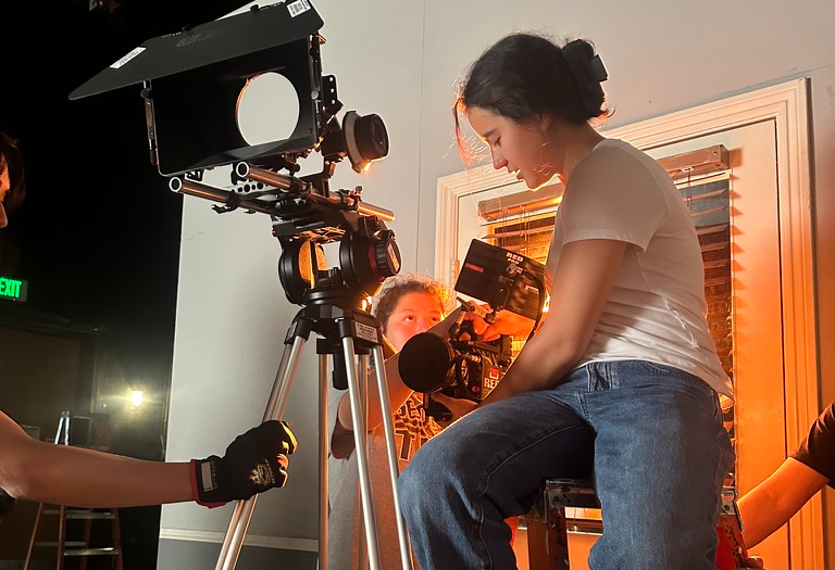 Junior Indi Melvin adjusts a camera while shooting a short film on set. Since she first dipped her feet into film production during the pandemic, Melvin has created seven short films. 