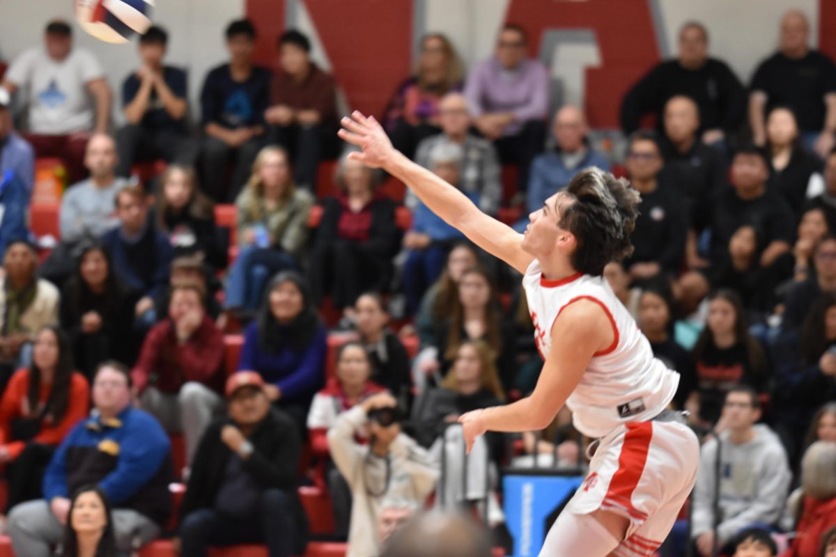 Team captain and outside hitter senior Luke Cowan flies into the air to deliver a powerful serve, which dropped unopposed between two Oakton defenders. McLean seemed to have noticeably improved in their serves, losing significantly fewer points from faulty serve than usual. 