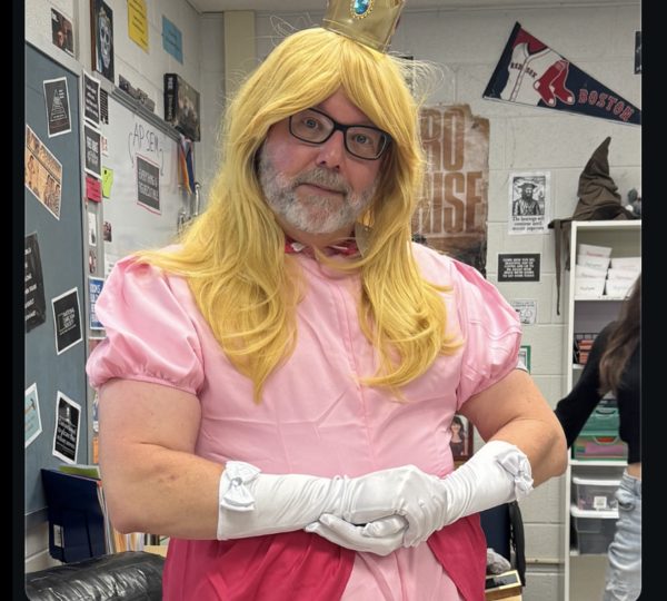 AP Seminar teacher Benjamin Letkiewicz dresses up as Princes Peach, a 
character from Nintendo’s Mario franchise, to participate in the English department’s Nintendo theme. The math department chose an Olympic theme and the science department dressed up as construction workers. 
