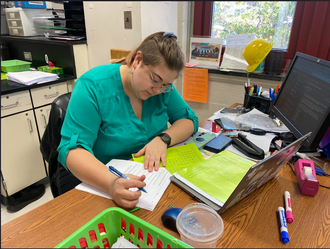 Chemistry teacher Cat Gamboa grades students’ tests in her classroom. Once all of the first quarter grades are inputted into the grading system, the FCPS grading committee will reexamine the new policy, and make changes if necessary.