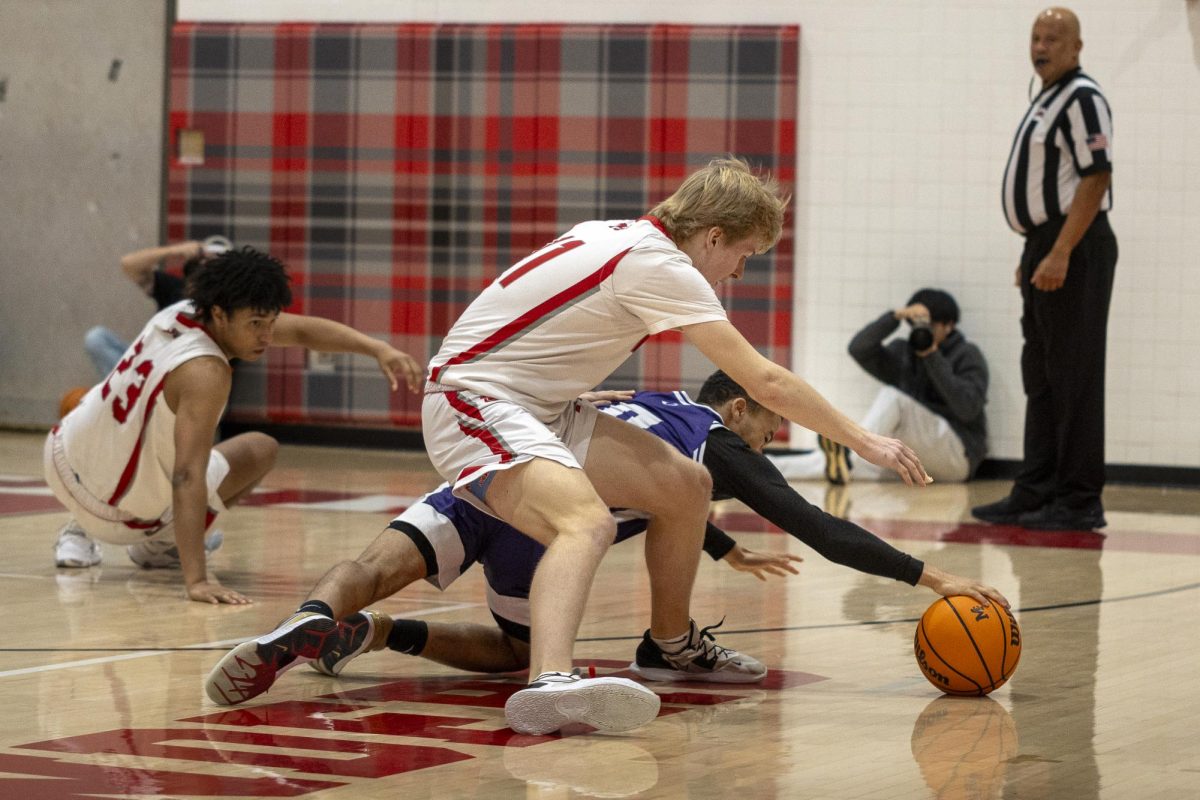 Senior guard Max Mullen dives for the ball on a fastbreak.