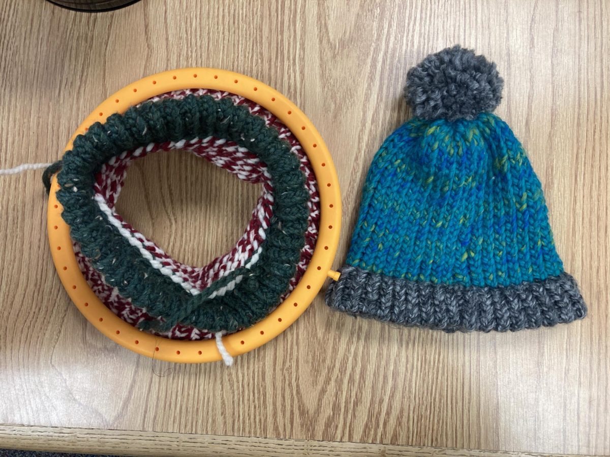  A half-finished hat sitting next to a finished one. These are the first of many created for the new library service project.