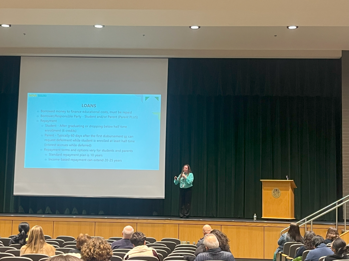 NOVA representative Shannon Martinez outlines the details of the FAFSA form to families of rising college freshmen. The financial aid seminar took place at Langley High School on Dec 3. 