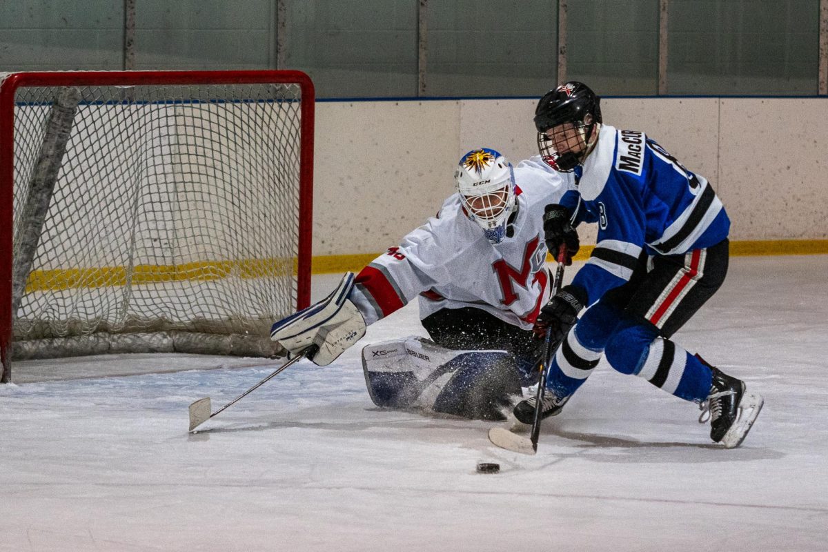 McLean goaltender Cayden Bryce Stops a Tuscarora/Loudoun forward on a quick break for the save