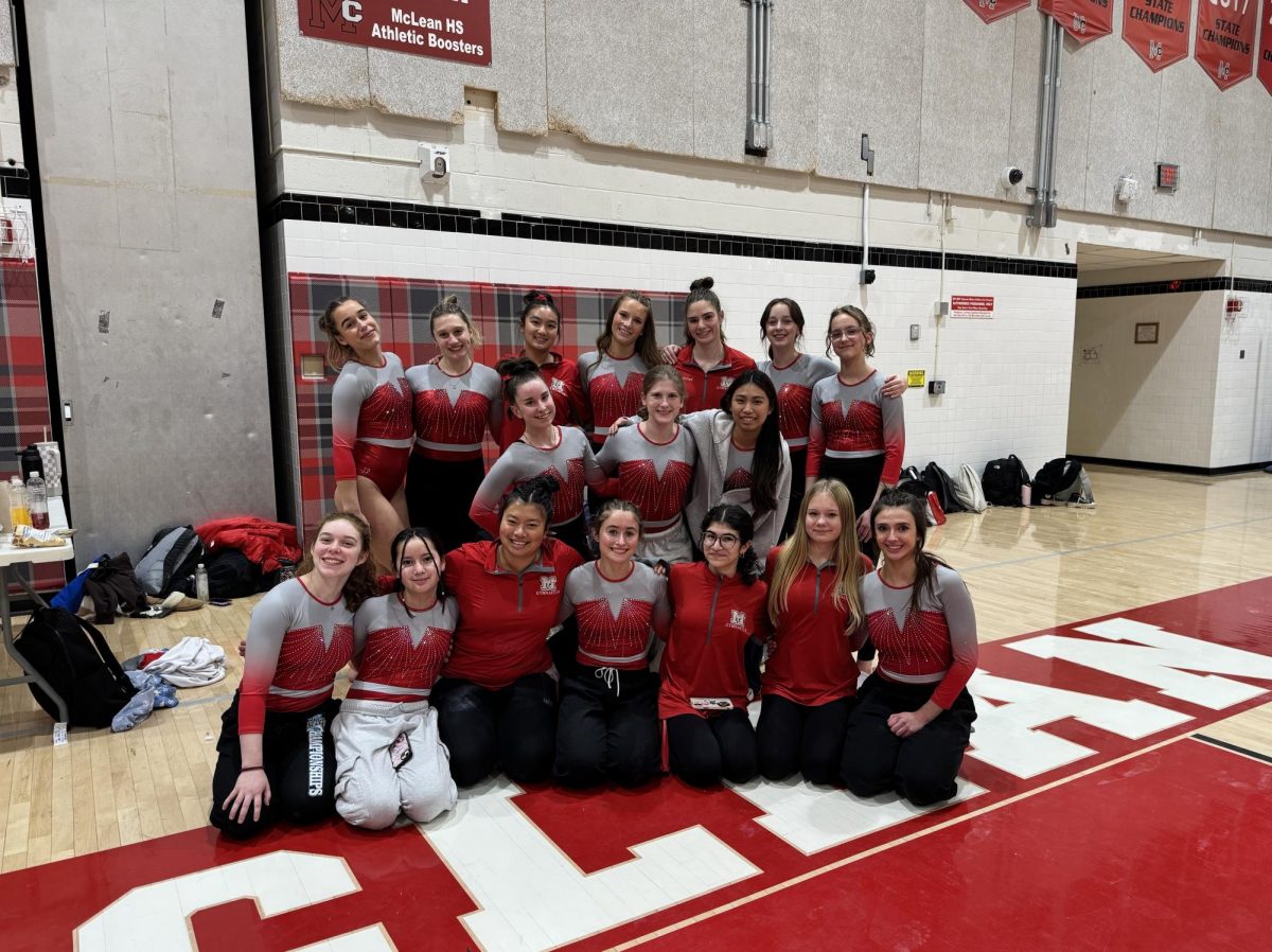 McLean's gymnastics team smiles after their victory on Dec. 2. They hope to carry their momentum through the regular season to states.