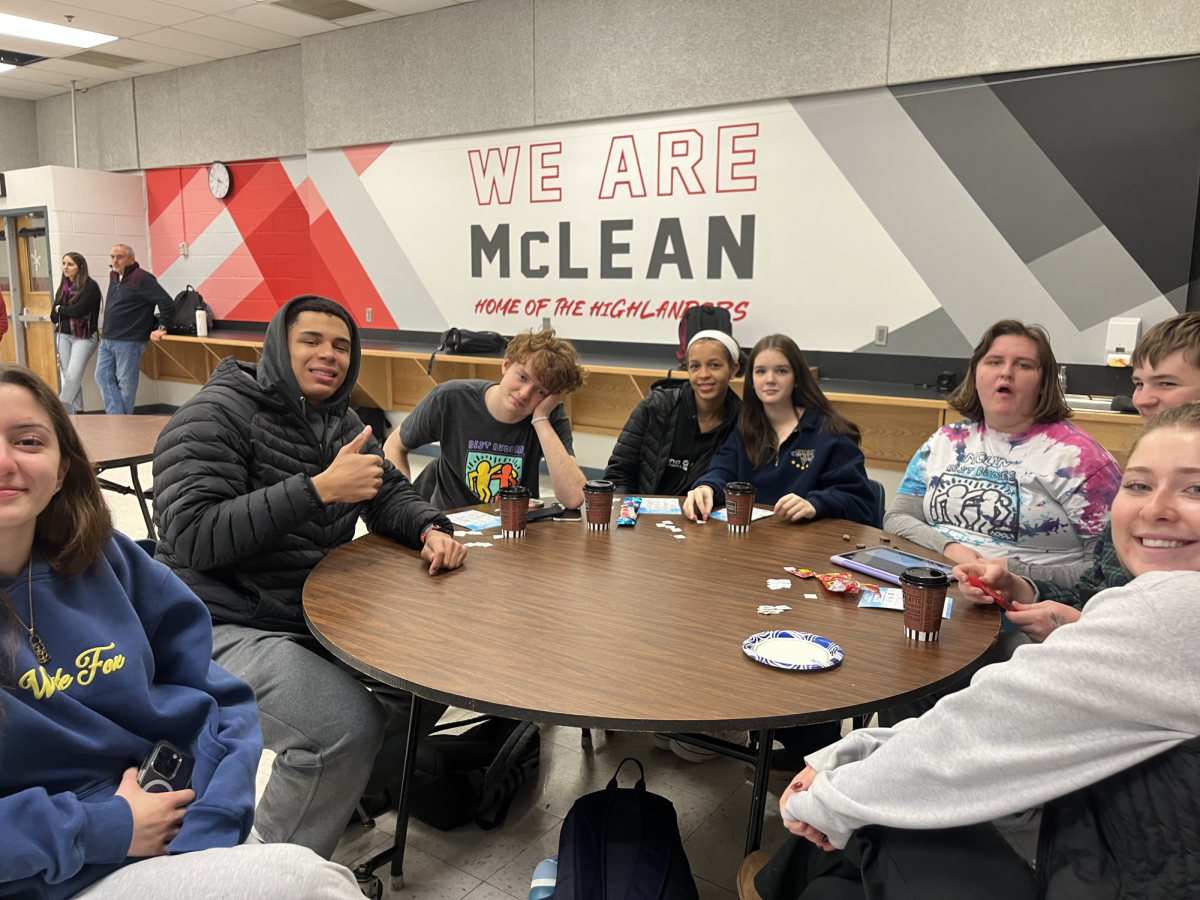 Best Buddies members enjoy hot chocolate and winter bingo during the meeting. The winter treats and weather added to the cozy atmosphere of the club gathering.