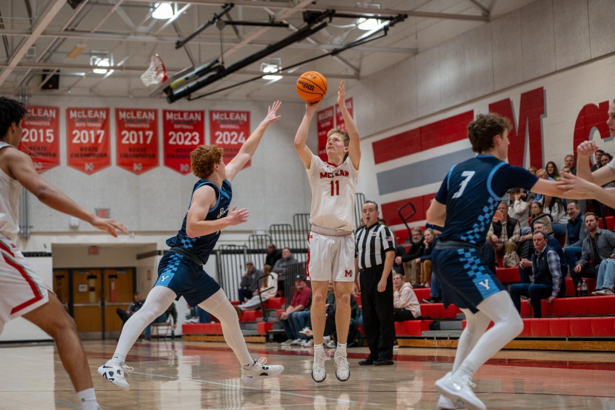 Senior guard Max Mullen fires a three from deep. Mullen was a big part of this game, contributing to multiple pivotal plays.
