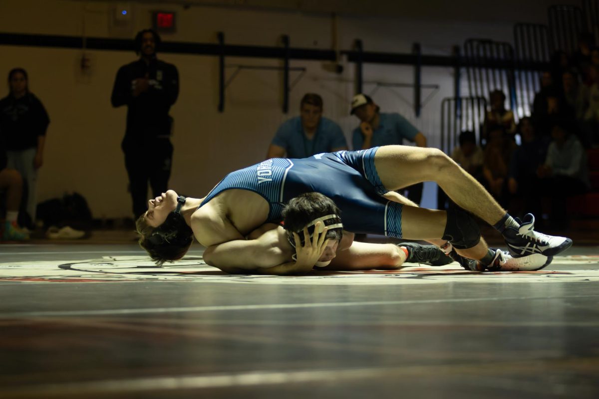 Senior Philip Davis dominates his opponent. Davis handily defeated the contestant at 136, beating him by tech fall.