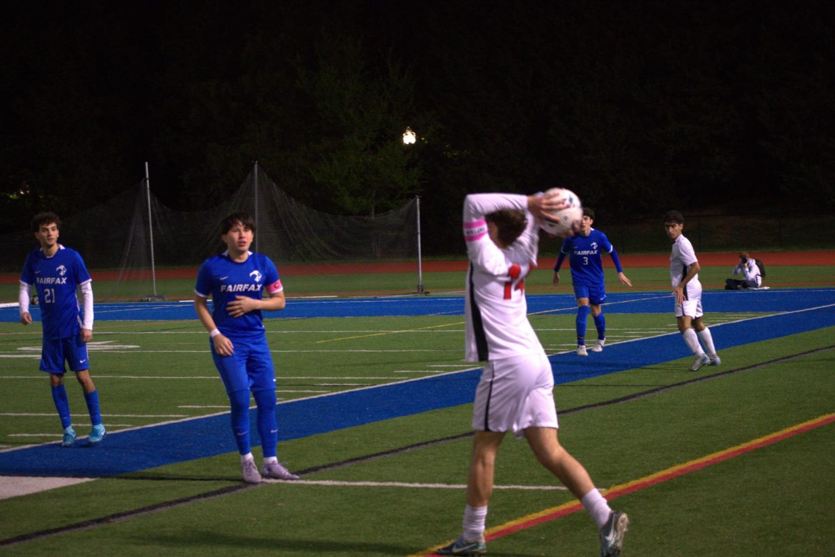 Senior defender Will Saxon takes a throw-in. Two of Saxon's throw-ins ended in goals for the Highlanders.