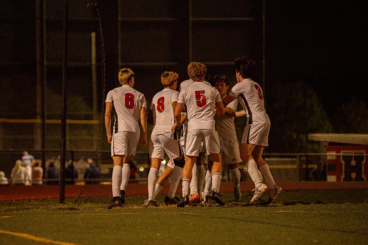 The McLean boys varsity soccer team celebrates after an incredible strike from senior defender Mikel Molina.